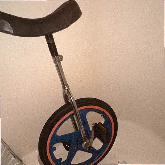 Blue Single Wheel Unicycle Cycle with Black Seat, Orange Tire